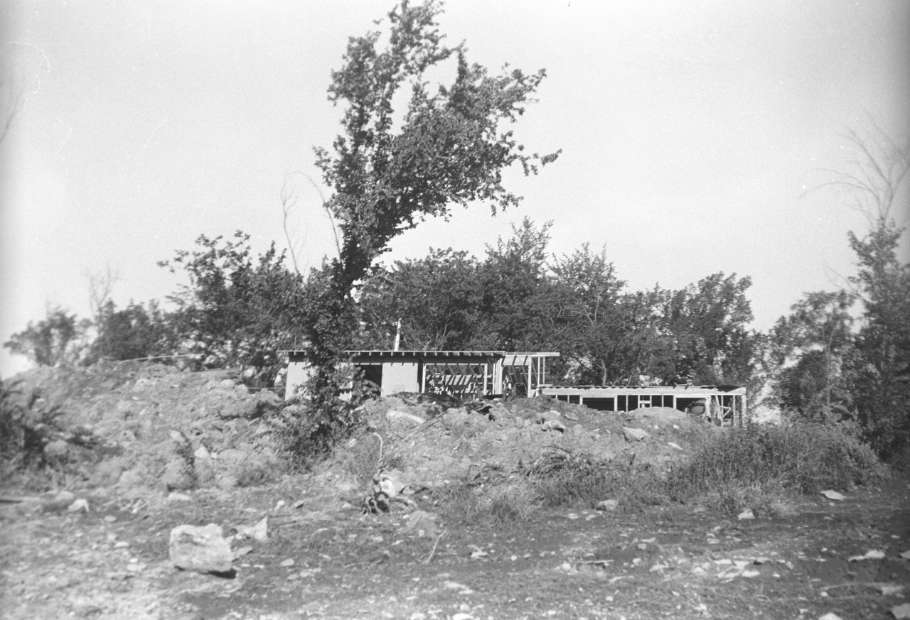 Road view of partially constructed house