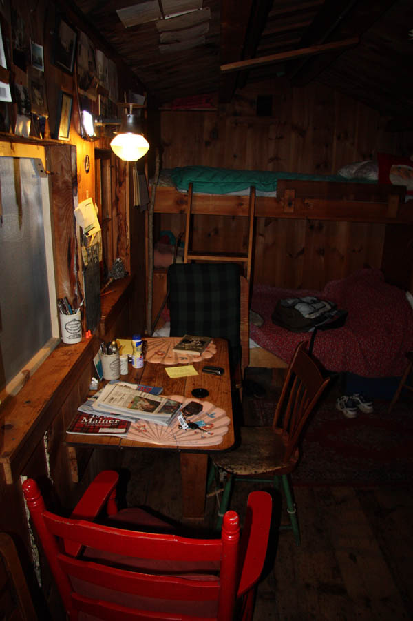 Interior at night, illuminated by kerosene lamp